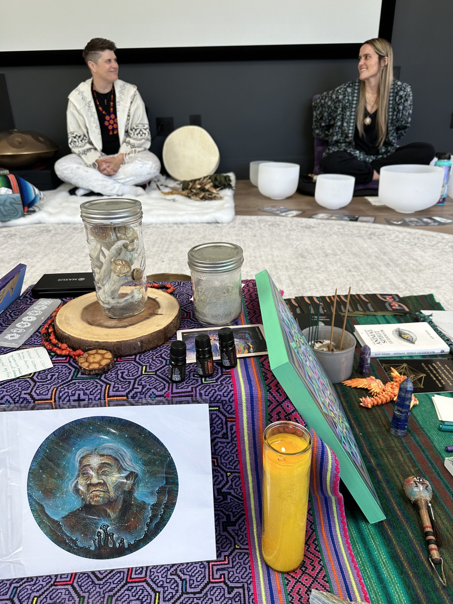 A table with people gathered around it at a Colorado mushroom retreat